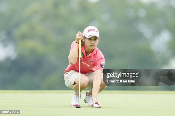 Hiromu Ono of Japan lines up for a putt on the 18th green during the final round of the Yupiteru The Shizuoka Shimbun & SBS Ladies at the Shizuoka...