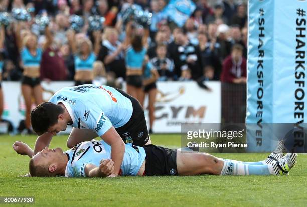 Luke Lewis of the Sharks is congratulated by Chad Townsend of the Sharks after scoring a try during the round 16 NRL match between the Cronulla...