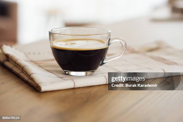 morning boost. double espresso, anybody? - coffee cups table stock pictures, royalty-free photos & images