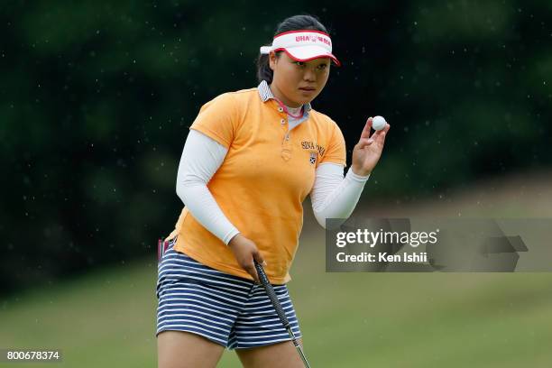 Eriko Tanikawa of Japan acknowlegdes after her birdie on the 9th green during the final round of the Yupiteru The Shizuoka Shimbun & SBS Ladies at...