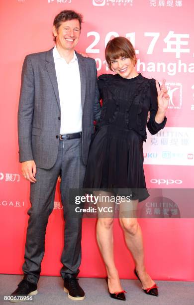 Ukrainian-born actress Milla Jovovich and her husband English director Paul William Scott Anderson attend the Press Conference for Actors on the Red...