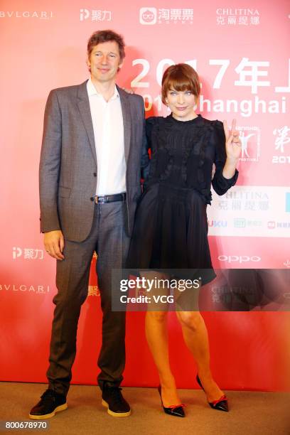 Ukrainian-born actress Milla Jovovich and her husband English director Paul William Scott Anderson attend the Press Conference for Actors on the Red...