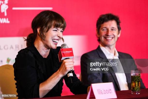 Ukrainian-born actress Milla Jovovich and her husband English director Paul William Scott Anderson attend the Press Conference for Actors on the Red...