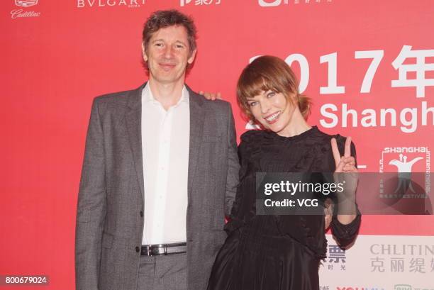 Ukrainian-born actress Milla Jovovich and her husband English director Paul William Scott Anderson attend the Press Conference for Actors on the Red...