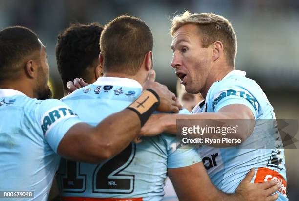 Matt Prior of the Sharks celebrates after Sosaia Feki of the Sharks scored a try during the round 16 NRL match between the Cronulla Sharks and the...