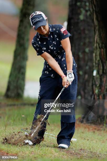 Keiko Sasaki of Japan hits a recovery shot on the 18th hole during the final round of the Yupiteru The Shizuoka Shimbun & SBS Ladies at the Shizuoka...