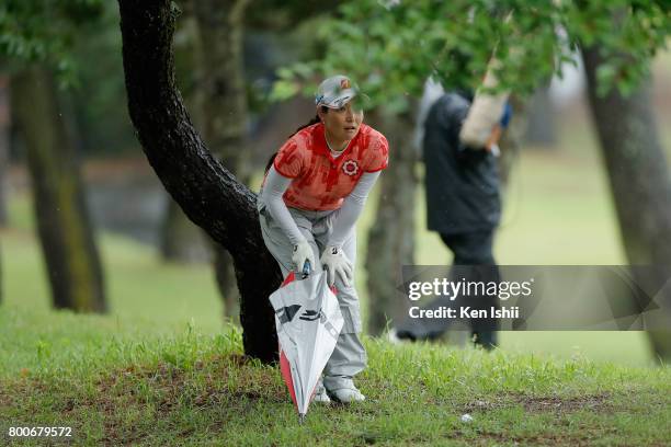 Tomoko Yokoyama of Japan prepares for a second shot on the 18th hole during the final round of the Yupiteru The Shizuoka Shimbun & SBS Ladies at the...