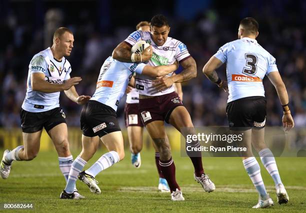 Frank Winterstein of the Sea Eagles is tackled during the round 16 NRL match between the Cronulla Sharks and the Manly Sea Eagles at Southern Cross...