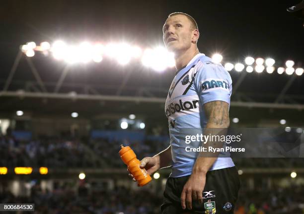 Luke Lewis of the Sharks leaves the ground with an injury during the round 16 NRL match between the Cronulla Sharks and the Manly Sea Eagles at...