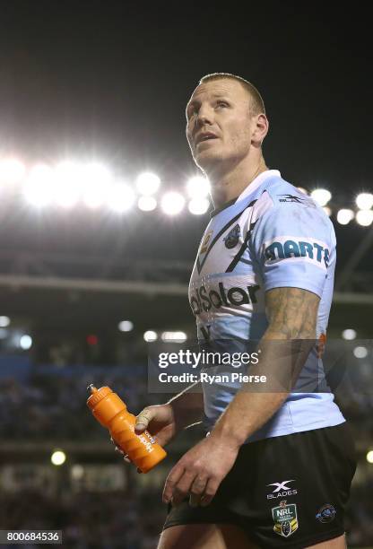 Luke Lewis of the Sharks leaves the ground with an injury during the round 16 NRL match between the Cronulla Sharks and the Manly Sea Eagles at...