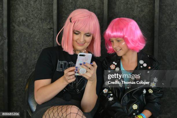 Rydel Lynch of the Pop Band R5 looks at selfies with Beauty Crone at Elitch Gardens on June 24, 2017 in Denver, Colorado.