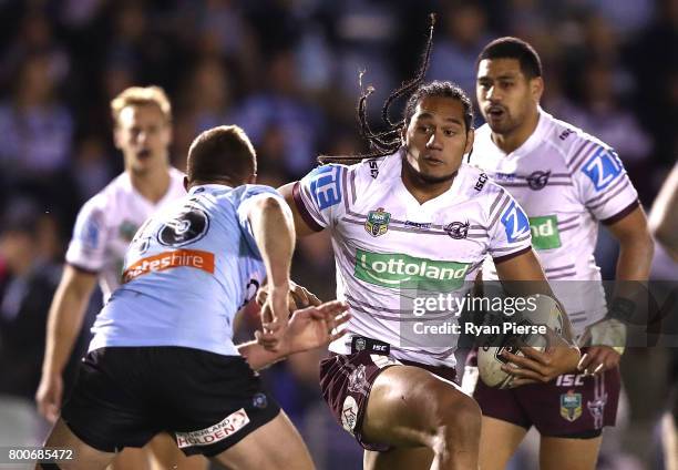 Martin Taupau of the Sea Eagles makes a break during the round 16 NRL match between the Cronulla Sharks and the Manly Sea Eagles at Southern Cross...