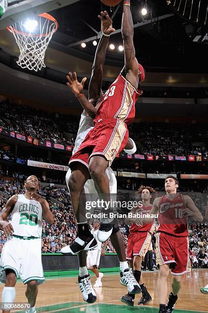 LeBron James of the Cleveland Cavaliers goes to the basket and scores his 10,000th point over Kevin Garnett of the Boston Celtics during the game on...