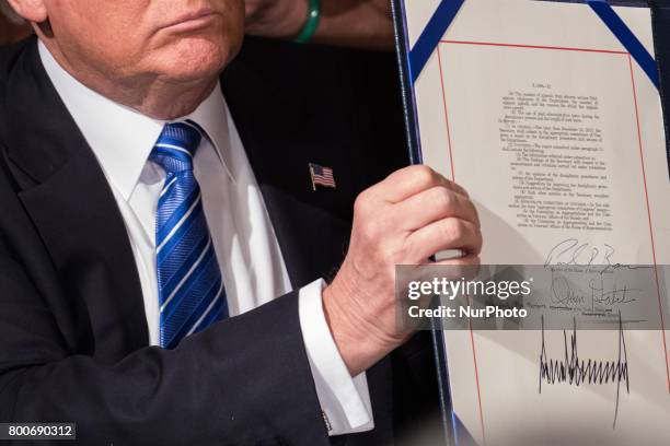 President Donald Trump signed the Department of Veterans Affairs Accountability and Whistleblower Protection Act of 2017, in the East Room of the...