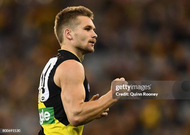 Dan Butler of the Tigers celebrates kicking a goal during the round 14 AFL match between the Richmond Tigers and the Carlton Blues at Melbourne...