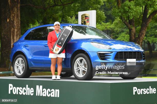 Ai Suzuki of Japan poses with the prize car after winning the Earth Mondamin Cup at the Camellia Hills Country Club on June 25, 2017 in Sodegaura,...