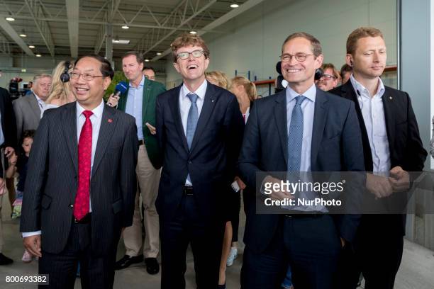 Berlin's Mayor Michael Mueller , Chinese Ambassador to Germany Shi Mingde and CEO of Berlin Brandenburg Airport Engelbert Luetke Daldrup are pictured...