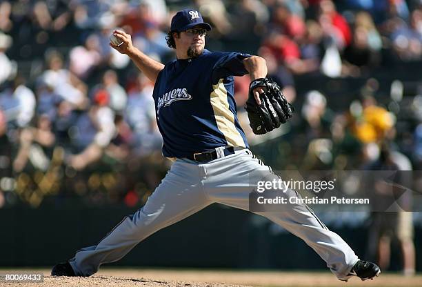 Relief pitcher Eric Gagne of the Milwaukee Brewers pitches against the Oakland Athletics during the spring training game at Phoenix Municipal Stadium...