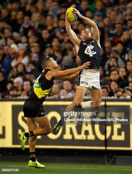 Shaun Grigg of the Tigers and Sam Docherty of the Blues compete for the ball during the 2017 AFL round 14 match between the Richmond Tigers and the...