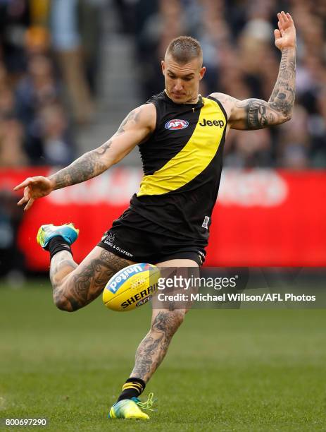 Dustin Martin of the Tigers kicks the ball during the 2017 AFL round 14 match between the Richmond Tigers and the Carlton Blues at the Melbourne...