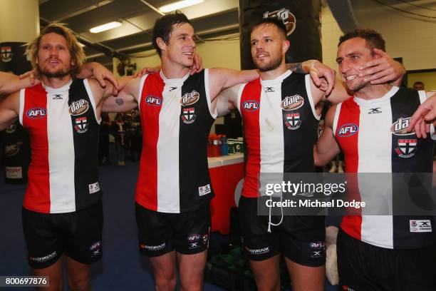 Sam Gilbert Jake Carlisle, Nathan Brown and Luke Dunstan of the Saints sing the club song after winning during the round 14 AFL match between the St...