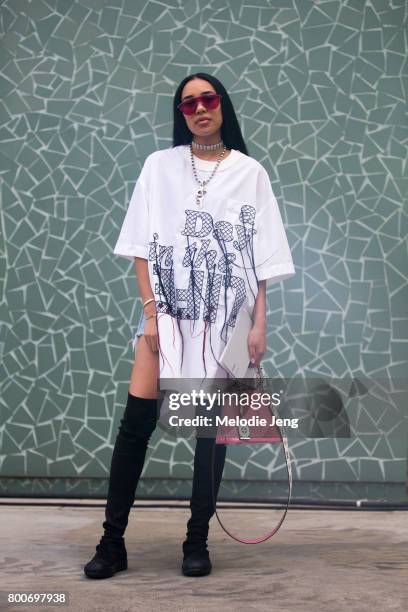 Aleali May wears Sacai, Louis Vuitton, Martine Ali, and Rick Owens outside the Sacai show on June 24, 2017 in Paris, France.