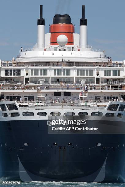 British cruise ship Queen Mary 2 arrives in Saint-Nazaire, western France, on June 24 the day before the start of The Bridge 2017, a transatlantic...