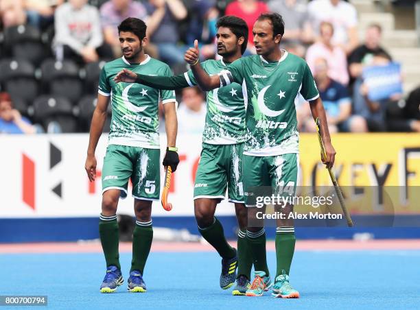 Muhammad Umar Bhutta of Pakistan celebrates scoring his sides first goal with his Pakistan team mates during the 7th/8th place match between Pakistan...