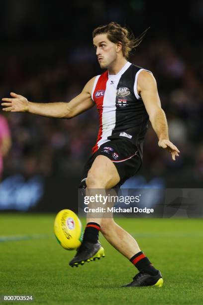 Josh Bruce of the Saints kicks the ball during the round 14 AFL match between the St Kilda Saints and the Gold Coast Suns at Etihad Stadium on June...