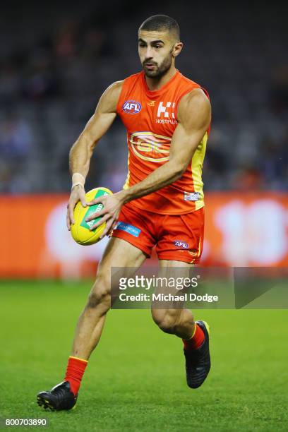 Adam Saad of the Suns looks upfield during the round 14 AFL match between the St Kilda Saints and the Gold Coast Suns at Etihad Stadium on June 25,...