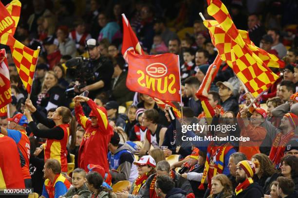 Suns fans celebrate a goal during the round 14 AFL match between the St Kilda Saints and the Gold Coast Suns at Etihad Stadium on June 25, 2017 in...