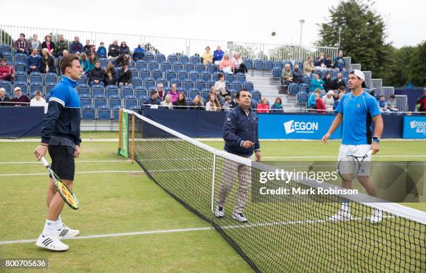 Marton Fucsovics of Hungary and Alex Bolt of Australia coin toss before their men's singles final on June 25, 2017 in Ilkley, England.