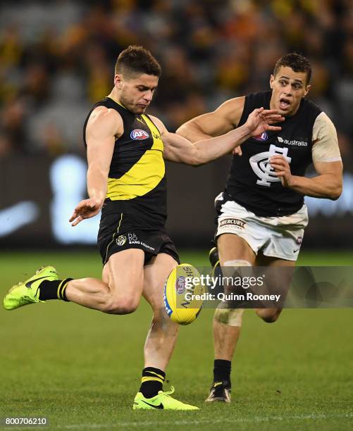 Dion Prestia of the Tigers kicks during the round 14 AFL match between the Richmond Tigers and the Carlton Blues at Melbourne Cricket Ground on June...