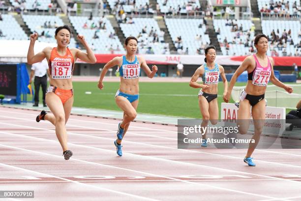 Kana Ichikawa, Chisato Fukushima, Yukina Shimada and Mizuki Nakamura of Japan compete in the Women 200m final during the 101st Japan National...