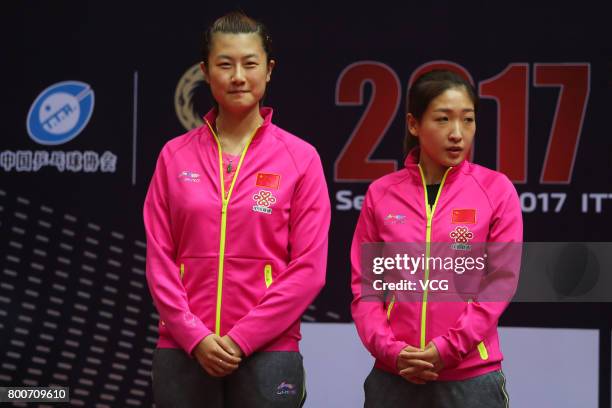 Winner Ding Ning and Liu Shiwen of China attend the award ceremony after Women's doubles final match of 2017 ITTF World Tour China Open at Sichuan...