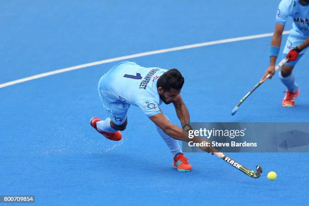 Harmanpreet Singh of India scores their teams first goal from a penalty corner during the 5th/6th place match between India and Canada on day nine of...