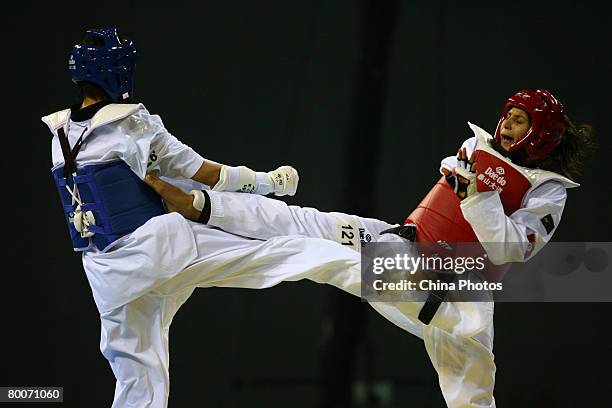 Liu Wenyuan of China fights with Ben Hamza Khaoula of Tunisia during women's over 67kg final of the "Good Luck Beijing" 2008 International Taekwondo...