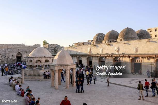 Muslims gather to perform the Eid al-Fitr prayer at Umayyad Mosque, in Idlib, Syria on June 25, 2017. Eid al-Fitr is a religious holiday celebrated...