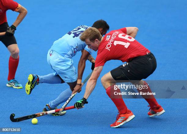 Gordan Johnston of Canada and Sunil Sowmarpet of India battle for possession during the 5th/6th place match between India and Canada on day nine of...