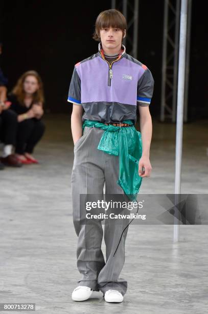 Model walks the runway at the Lanvin Spring Summer 2018 fashion show during Paris Menswear Fashion Week on June 25, 2017 in Paris, France.