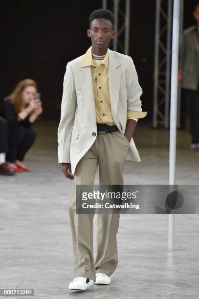 Model walks the runway at the Lanvin Spring Summer 2018 fashion show during Paris Menswear Fashion Week on June 25, 2017 in Paris, France.