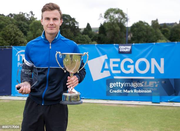 Marton Fucsovics of Hungary celebrates winning the men's singles final on June 25, 2017 in Ilkley, England.