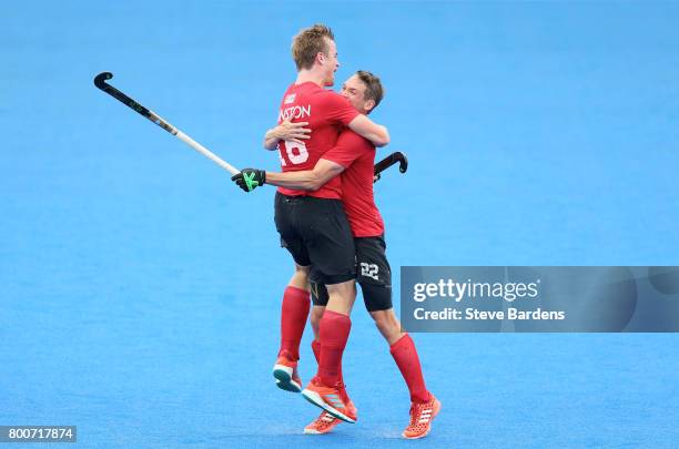 Gordan Johnston of Canada celebrates scoring their teams third goal wiht teammate John Smythe of Canada during the 5th/6th place match between India...