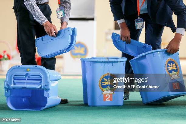 Officials check portable box for elderly and disabled people, on the eve of Mongolian presidential election in Ulan Bator, on June 25, 2017. Voters...