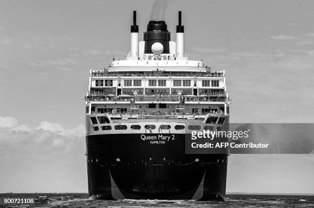British cruise ship Queen Mary 2 arrives in Saint-Nazaire, western France, on June 24 the day before the start of The Bridge 2017, a transatlantic...