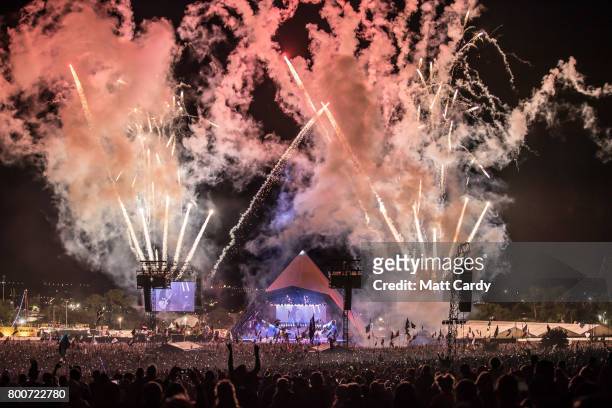 Fireworks mark the end of the Foo Fighters performance at the Glastonbury Festival site at Worthy Farm in Pilton on June 24, 2017 near Glastonbury,...