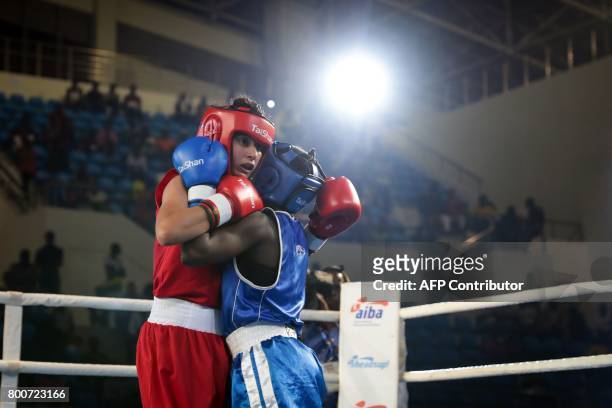 Central African Republic's Nadege Marline Niambongui and Algeria's Ouidad Sfouh fight on the ring during the African Championships of the...