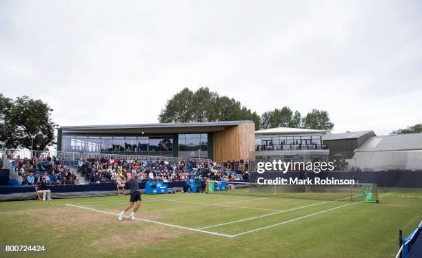 Marton Fucsovics of Hungary serves during the men's singles final on June 25, 2017 in Ilkley, England.