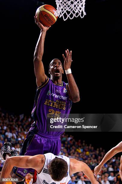 Isaiah Victor of the Kings shoots for goal off the back of Brad Robbins of the Wildcats during game three of the NBL semi-final series between the...