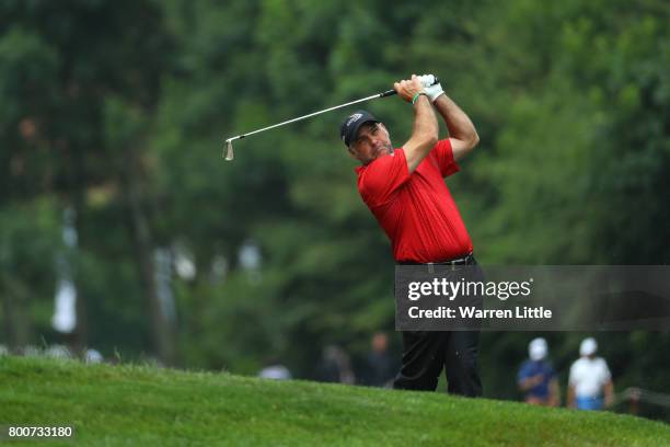 Hennie Otto of South Africa hits his second shot on the 10th hole during the final round of the BMW International Open at Golfclub Munchen Eichenried...